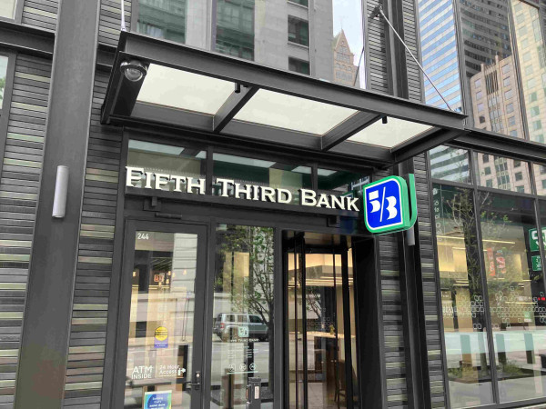 Outside shot of the “fifth third bank” their logo is 5/3