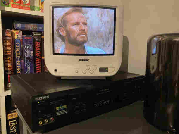 A 9-inch sony trinitron tv shows a scene from Planet of the apes, as a sony vcr plays the tape below. 