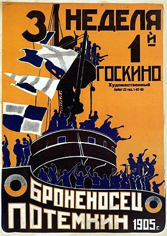 Battleship Potemkin original movie poster, orange, with black and blue image of a ship, filled with protesting sailors, fists in the air. By Not mentioned on poster - https://www.imdb.com/title/tt00000000015648/Description and large version in Russian State Library: https://search.rsl.ru/ru/record/01008520003, Public Domain, https://commons.wikimedia.org/w/index.php?curid=2957676