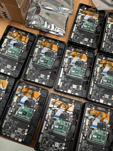 10 almost assembled MNT Pocket Reform open hardware mini laptops