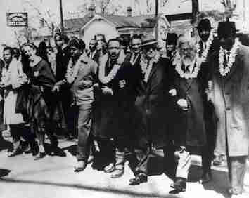 The third Selma Civil Rights March frontline. From far left: John Lewis, an unidentified nun; Ralph Abernathy; Martin Luther King Jr.; Ralph Bunche; Rabbi Abraham Joshua Heschel; Frederick Douglas Reese. Second row: Between Martin Luther King Jr. and Ralph Bunche is Rabbi Maurice Davis. Heschel later wrote, "When I marched in Selma, my feet were praying." Joseph Ellwanger is standing in the second row behind the nun. By http://www.dartmouth.edu/~religion/faculty/heschel-photos.htmlThis URL is [as of Sept. 17, 2014] a dead link; Therefore, for a web.archive.org (Wayback machine) "snapshot" of this URL, please (feel free to) refer to this "archived" copy: "Heschel Selected Photos". the Trustees of Dartmouth College [faculty] [Department of Religion]. Archived from the original on Sep 17, 2014. Retrieved Sep 17, 2014., Fair use, https://en.wikipedia.org/w/index.php?curid=5004303