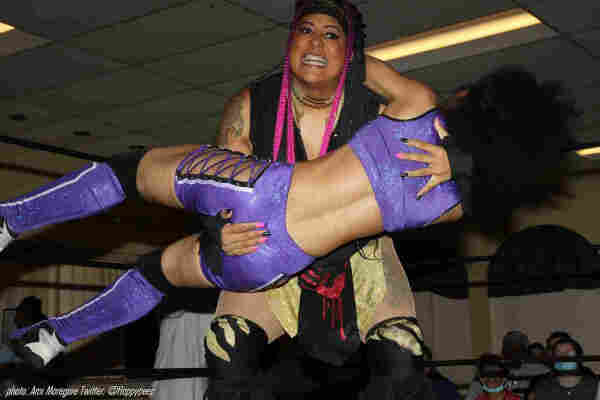Nyla Rose carrying an opponent in her arms