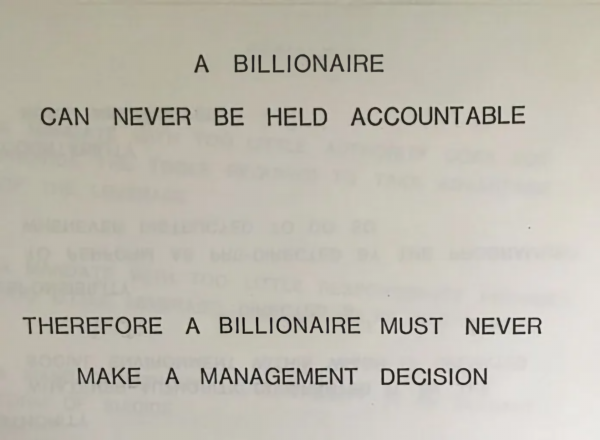 A photo of a page from a book, reading "A BILLIONAIRE CAN NEVER BE HELD ACCOUNTABLE THEREFORE A BILLIONAIRE MUST NEVER MAKE A MANAGEMENT DECISION"