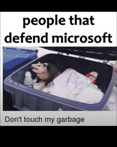An advertisement shows a dog in a garbage can with a caption about people who defend microsoft.