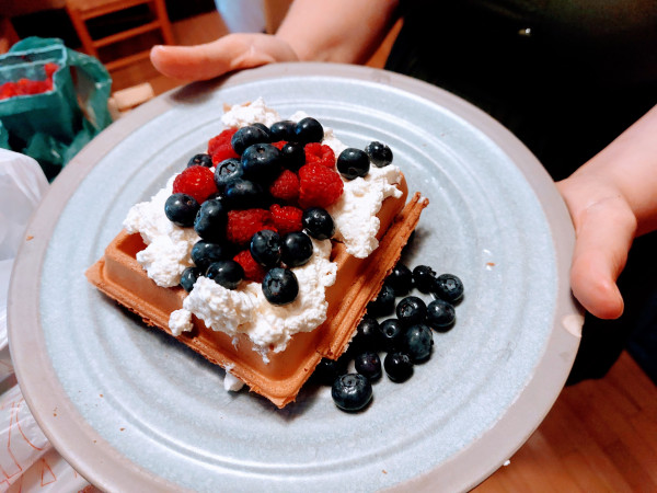 A Belgian waffle topped with whipped cream, blueberries and raspberries. What could be more patriotic?