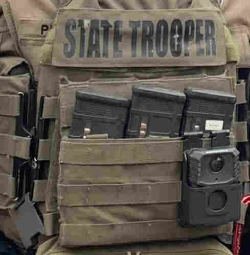 Close up shot of a State Trooper flak jacket crammed with bullet clips for an AR-15