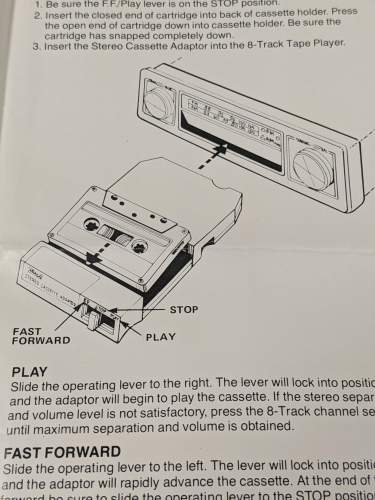 line drawing of the proper method for inserting a cassette into the 8-track adaptor and then the adaptor into the 8-track player