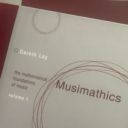 volume 1 of ‘musimathics: the mathematical foundations of music’ by garett loy. the photo (truthfully) implies that volume 2 is behind it. 
