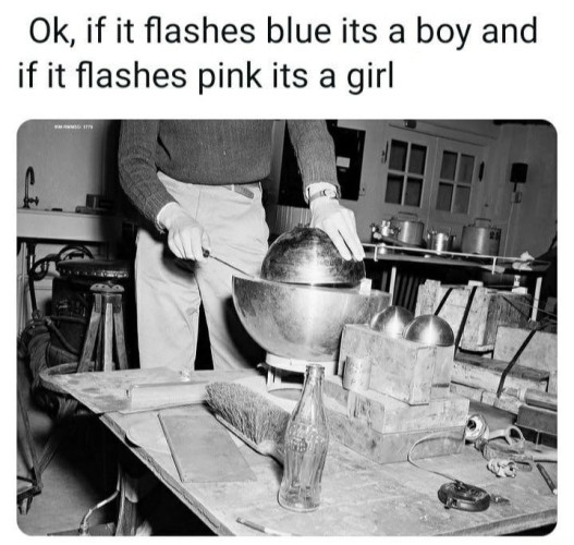 Still image. Recreation of the fatal demon core criticality incident, two metal orbs held separated by just a screwdriver, just before they clap together and kill multiple people in the room slowly and painfully. 

Top text reads:
Ok, if it flashes blue its a boy and if it flashes pink its a girl