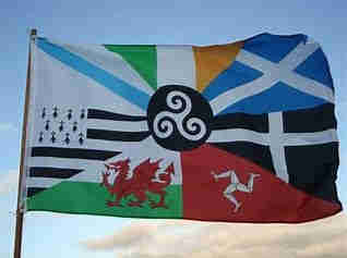 The flag of the Celtic Alliance.  A black and white triskele at the centre, surrounded by the flags of Wales, Ireland, Scotland, Cornwall, Brittany and the Isle of Man.