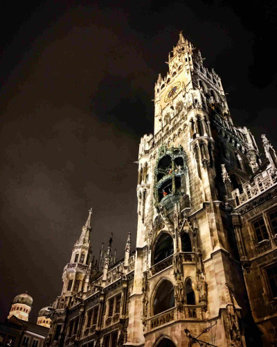 The New Town Hall (German: Neues Rathaus) in the northern part of Marienplatz in Munich, Bavaria, Germany. at night against a dark sky.