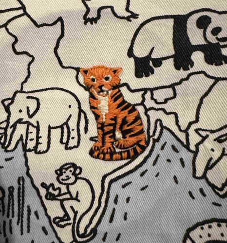 A small embroidered tiger with a 1000 yard stare. 