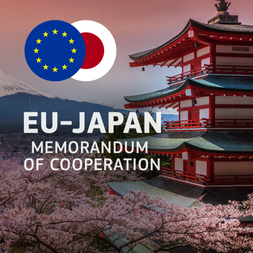 A sunset view of Mount Fuji and Chureito Pagoda in Japan, surrounded by cherry blossoms. The overlay text reads: EU-JAPAN Memorandum of Cooperation. Two circles enclosing the EU and Japan flags are also depicted above the mountain. 