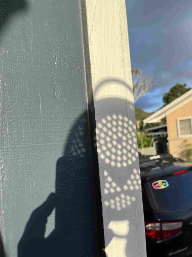 I held up a colander until the shapes projected out the holes were not circles and matched up with the shape of the partial eclipse at my location.