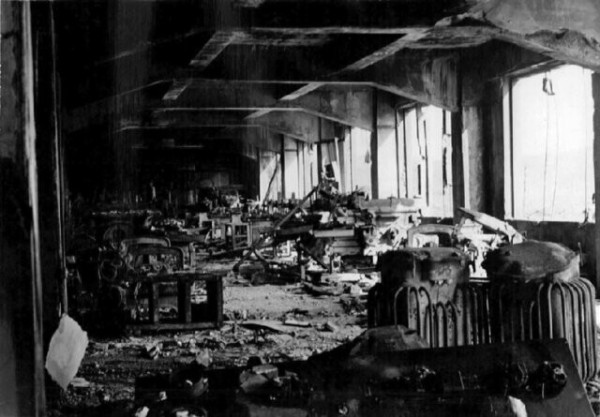 Chinzei Middle School, Nagasaki 1945 after the nuclear attack. Image shows a devastated classroom and materials in black and white.