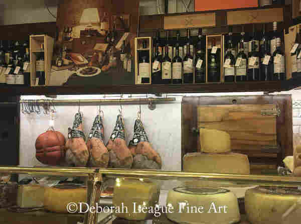 Cheese and Meat Display at Giuseppe Giusti, Modena, Italy. Known since the 17th century for its award winning balsamic vinegar, Giuseppe Giusti is also a purveyor of fine cheese, cured meats and wine. This image features a vintage display case in the original 17th century store, still in operation, in Modena.