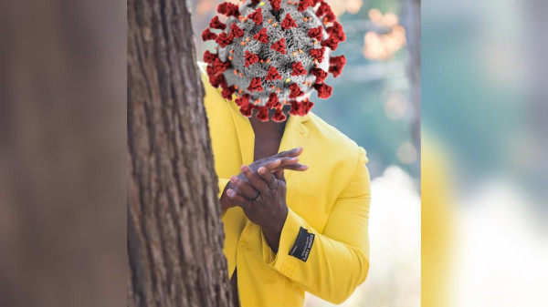 anthony adams rubbing his hands behind a tree meme, with his read replaced by COVID-19