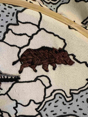 A small embroidered wild boar 