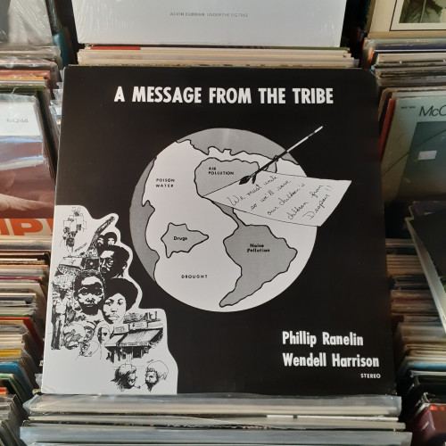 Album cover features a blank and white illustration of the Earth with various blights identified on the map. On top of it is a handwritten note about uniting for the sake of our children's children. In the bottom left corner is an illustration of peoples from the African diaspora.