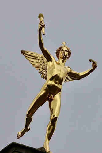 A golden naked male angel sculpture with its meat n two veg on full display 