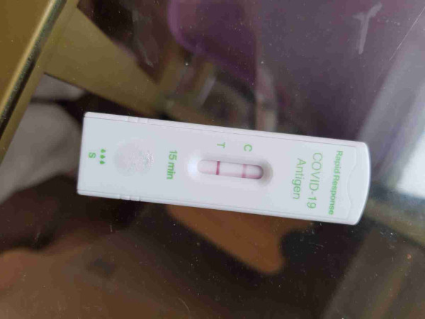 Photo of my home covid rapid test, showing positive.