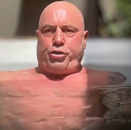 Joe Rogan cold plunging and making a ridiculous face.