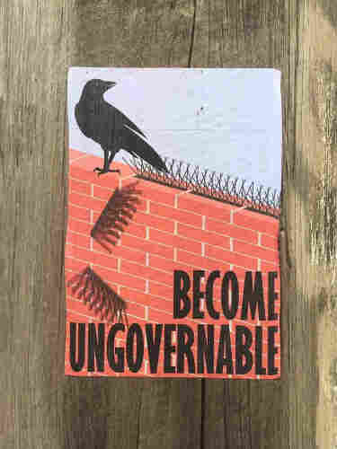 Poster on a wall of a bird pulling up anti&bird spikes and the words "Become Ungovernable