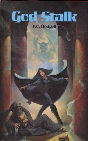 Cover is mostly in dark colors. The scene is a temple. In the background is an indistinct winged statue sitting in an alcove. In the foreground, two figures are framed by two pillars, in a way that's slightly claustrophobic. One figure is a young woman in a dancing pose. Her arms are out flung and her cloak is spread out like a pair of wings. at her feet is an old man wearing a robe, and clutching a book in his arms. He is sitting up, leaning against the pillar, and cringing away from the dancer. At the old man's feet is a smoking brazier.  

