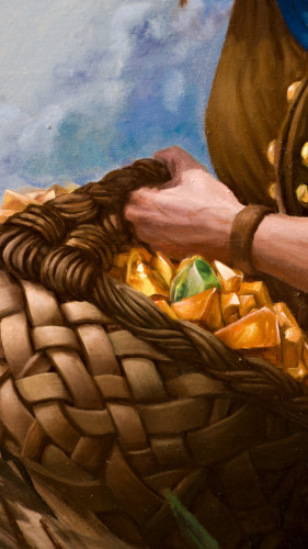 Part of an oilpainting where a hand is holding a big basket full of yellow gems.