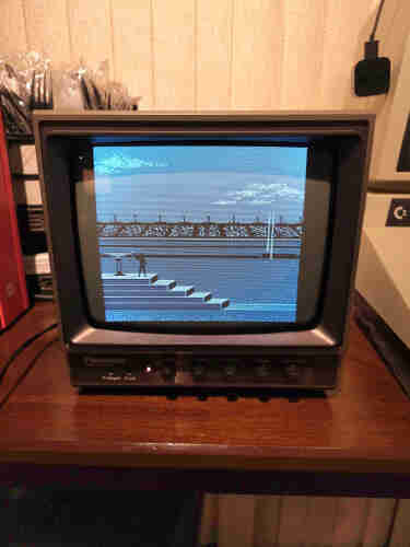 Panasonic TR-930 Black and White Video Monitor displaying the opening ceremonies from the Commodore 64 game Summer Games.