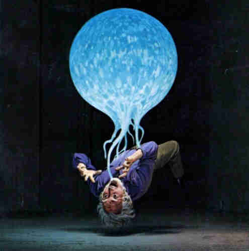 Illustration of a floating blue orb holding an older man in mid-air with tendrils. Man seems upset about it. 
