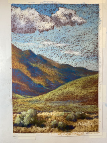 Vertical pastel painting of mountain ridges and valleys. A field of sagebrushes in the foreground. Puffy clouds in the sky, and their shadows on the mountainside. This is still work-in-progress, but after today's in-studio work. 