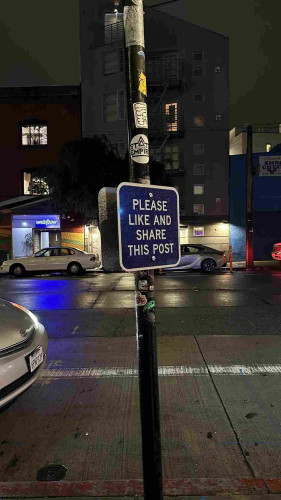 Street sign that says “please like and share this post”