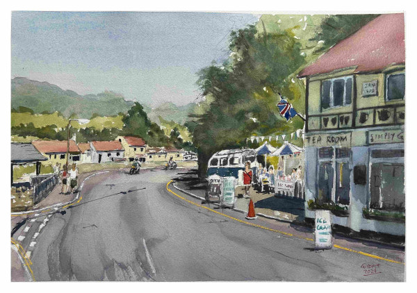 Watercolor painting of a curved street with people, buildings including a tea room, a vintage van, motorcycles, and a backdrop of green hills under a blue sky.