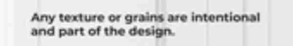Part of a clothing label with the text:

“Any texture or grains are intentional and part of the design.”