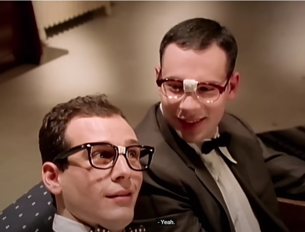 Two gentlemen wearing spectacles planning a party