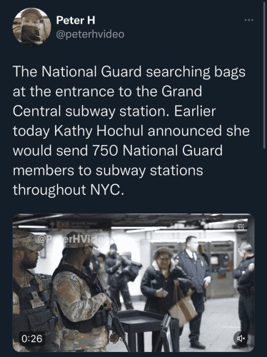 Image of soldiers holding guns and herding subway users through check points. Peter H (@PeterHVideo) 
"The National Guard searching bags at the entrance of Grand Central Station. Earlier today, Kathy Hochul announced she would send 750 National Guard members to subway stations throughout NYC