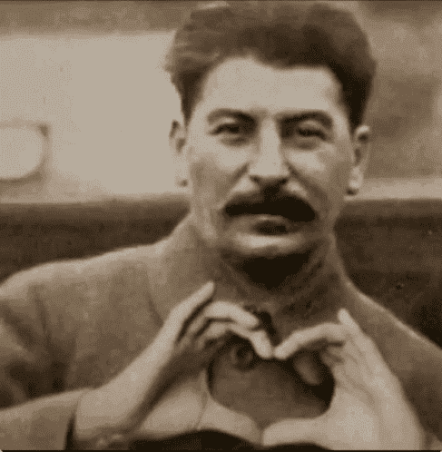 Stalin forming a heart shape with his hands.