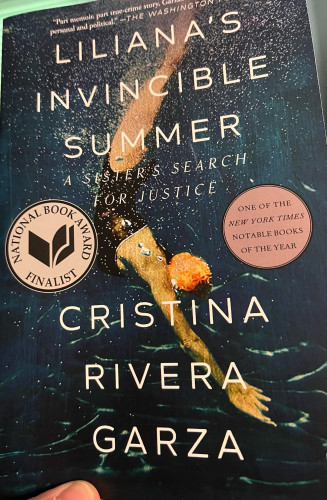 Book cover, “Liliana’s Invincible Summer”, showing a diver in bathing suit and swim cap under water 