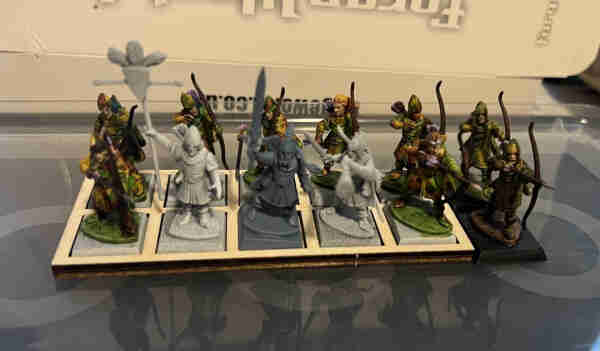 Warhammer Fantasy Miniatures

9 wood elf archers, painted green, brown, and yellow, with pastel purple fletching. 

Three unpainted unit command group. 