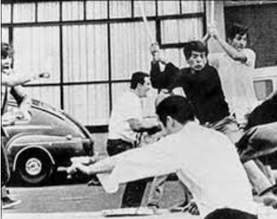 Halcones death squads beating up student protesters with sticks, during the Corpus Christi Massacre.